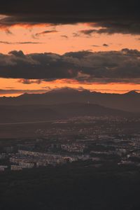 Preview wallpaper city, evening, mountains, sunset