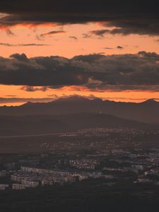 Preview wallpaper city, evening, mountains, sunset