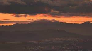 Preview wallpaper city, evening, mountains, sunset