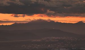 Preview wallpaper city, evening, mountains, sunset