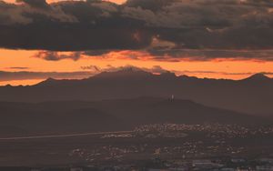 Preview wallpaper city, evening, mountains, sunset