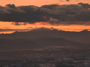 Preview wallpaper city, evening, mountains, sunset