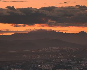 Preview wallpaper city, evening, mountains, sunset