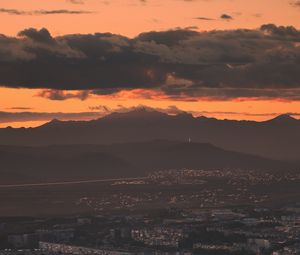 Preview wallpaper city, evening, mountains, sunset