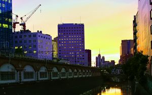 Preview wallpaper city, evening, river, buildings