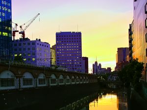 Preview wallpaper city, evening, river, buildings