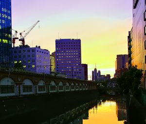 Preview wallpaper city, evening, river, buildings