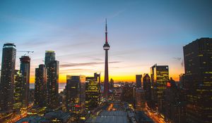Preview wallpaper city, evening, tower, buildings, sunset