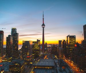Preview wallpaper city, evening, tower, buildings, sunset