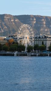 Preview wallpaper city, ferris wheel, coast, mountain, buildings