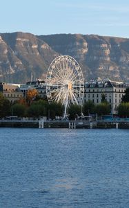 Preview wallpaper city, ferris wheel, coast, mountain, buildings