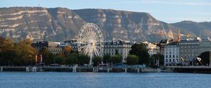 Preview wallpaper city, ferris wheel, coast, mountain, buildings