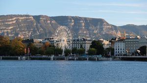 Preview wallpaper city, ferris wheel, coast, mountain, buildings