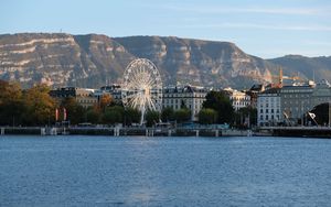 Preview wallpaper city, ferris wheel, coast, mountain, buildings