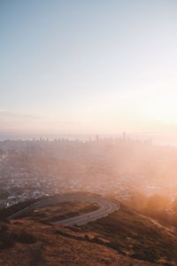 Preview wallpaper city, fog, aerial view, dawn, cityscape