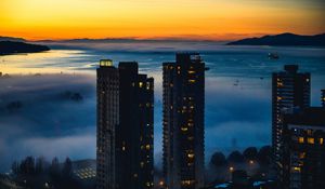 Preview wallpaper city, fog, harbor, twilight, skyscrapers, buildings