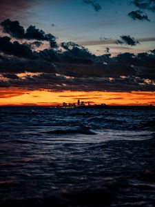 Preview wallpaper city, horizon, sunset, sea, waves