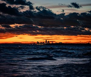 Preview wallpaper city, horizon, sunset, sea, waves