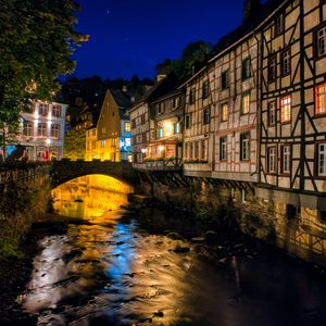 Preview wallpaper city, houses, buildings, bridge, river, night