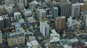 Preview wallpaper city, houses, buildings, aerial view, gray
