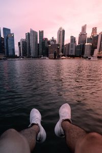 Preview wallpaper city, lake, legs, buildings, coast