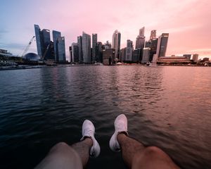 Preview wallpaper city, lake, legs, buildings, coast