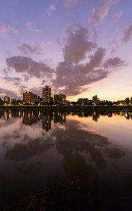 Preview wallpaper city, lake, shore, buildings, water, reflection