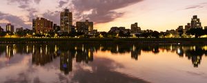 Preview wallpaper city, lake, shore, buildings, water, reflection