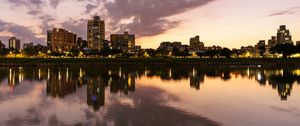 Preview wallpaper city, lake, shore, buildings, water, reflection