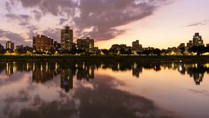 Preview wallpaper city, lake, shore, buildings, water, reflection