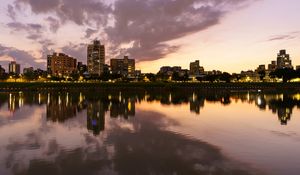Preview wallpaper city, lake, shore, buildings, water, reflection