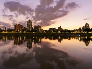 Preview wallpaper city, lake, shore, buildings, water, reflection