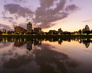 Preview wallpaper city, lake, shore, buildings, water, reflection