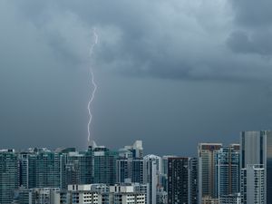 Preview wallpaper city, lightning, buildings, sky