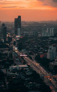 Preview wallpaper city, metropolis, aerial view, buildings, road