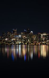 Preview wallpaper city, metropolis, buildings, coast, night, reflection