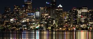 Preview wallpaper city, metropolis, buildings, coast, night, reflection