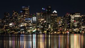 Preview wallpaper city, metropolis, buildings, coast, night, reflection