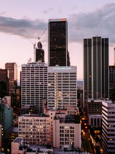 Preview wallpaper city, metropolis, skyscrapers, buildings, sunset