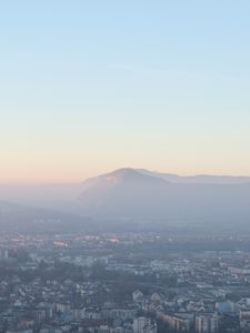 Preview wallpaper city, mountain, fog, sky, aerial view