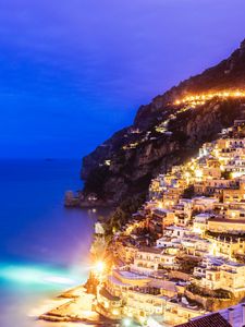 Preview wallpaper city, mountain, light, sea, twilight, evening