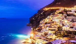 Preview wallpaper city, mountain, light, sea, twilight, evening
