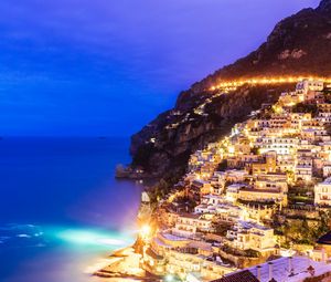 Preview wallpaper city, mountain, light, sea, twilight, evening