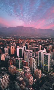 Preview wallpaper city, mountains, buildings, roofs, aerial view