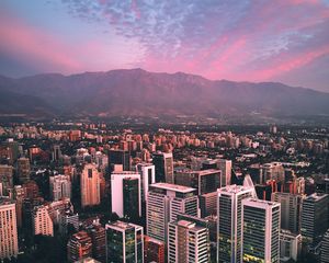 Preview wallpaper city, mountains, buildings, roofs, aerial view