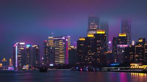 Preview wallpaper city, night city, buildings, water, purple