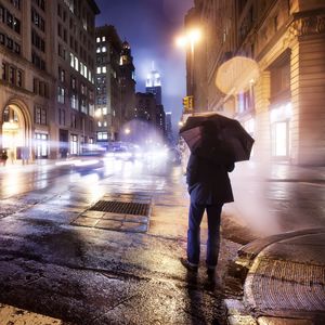 Preview wallpaper city, night, cloudy, lonely, man, umbrella