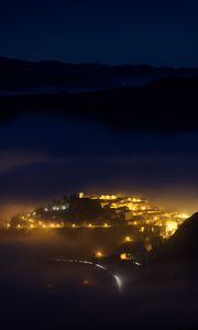 Preview wallpaper city, night, fog, light, mountains, rimini, italy