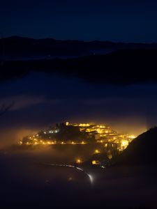 Preview wallpaper city, night, fog, light, mountains, rimini, italy