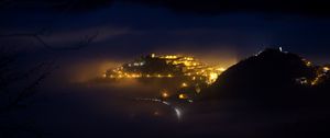 Preview wallpaper city, night, fog, light, mountains, rimini, italy